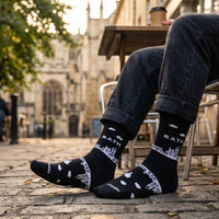Black Bath Skyline socks worn outdoors beside historic Bath buildings | Stand4 Socks