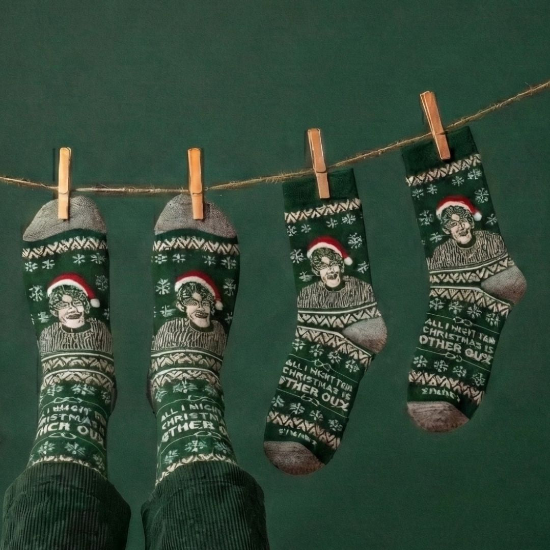 Green Christmas Theroux socks hanging from a clothesline against a dark green background | Stand4 Socks