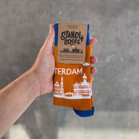 Amsterdam Skyline sock in packaging held against a grey background | Stand4 Socks buy one, give one to someone homeless
