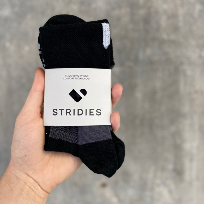 Black COOLMAX performance cycling socks in gift packaging | Stand4 Socks buy one, give one to someone homeless